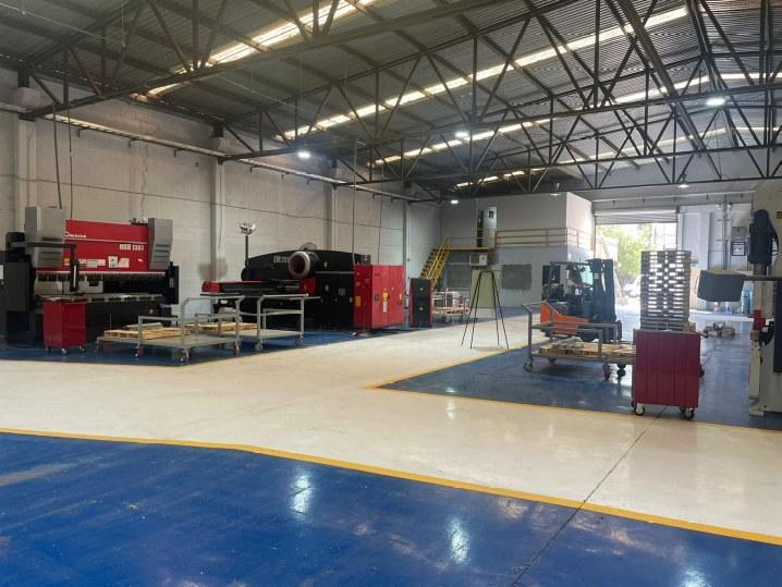 Divanttec Metal production floor in Monterrey, Mexico, with Amada CNC turret punch presses and press brake